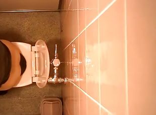 Hidden camera in women's bathroom spying on ladies peeing