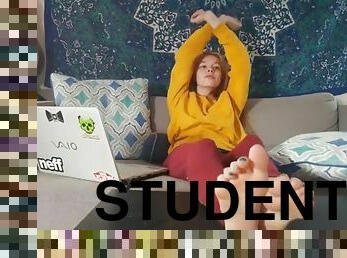 Student sits on couch, removes flipflops & shows soles