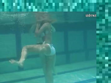 Retro footage of two underwater lesbians