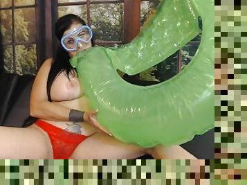 Blowing Up Green Pool Toy in Snorkel Mask