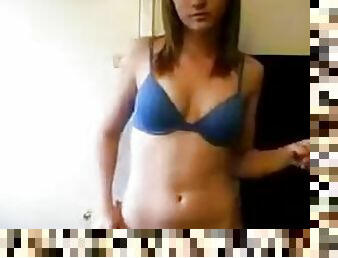 Teen wearing blue lingerie performs a striptease on webcam