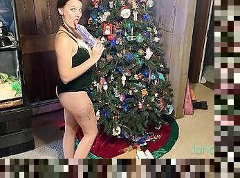 Naughty elf gets a huge dildo for Christmas and uses it to stretch out her pussy