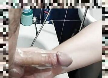 Bitch jerks off my hard soapy cock until I cum