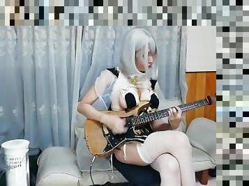 cosplay girl playing F-ZERO Bigblue on guitar