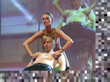 Hot blonde plays with her fan woman on the stage