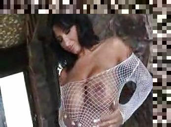 Big tits chick in a fishnet top sucks on cock