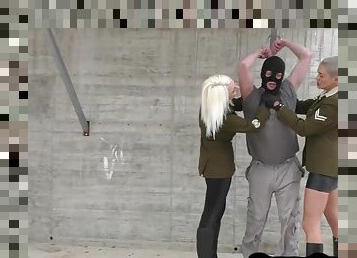 Military femdoms give BDSM ballbusting 3some outdoor