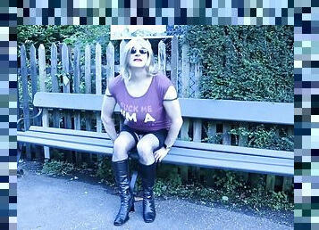 Crossdresser outdoors in a public train station