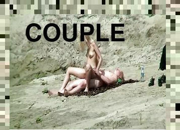 Naked couple fucking in the rocks