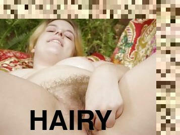 Curvy hairy blonde oils up her pale skin and fingers her wet cunt