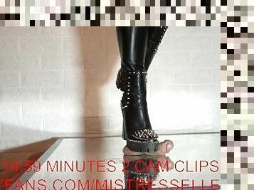 Mistress elle presents her spiked boots to her slave