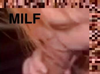 Red headed milf sucks off dick in car.