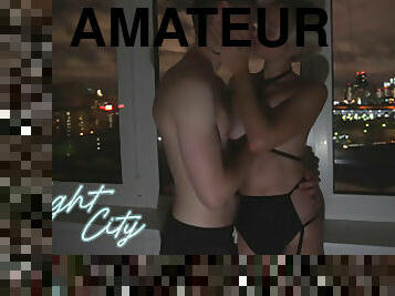 AMATEUR COUPLE FUCK NEAR WINDOW WITH NIGHT CITY VIEW