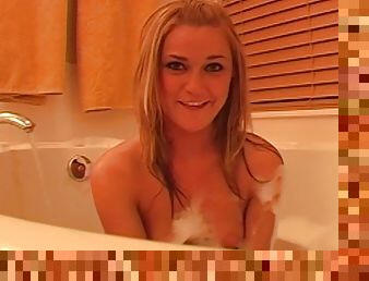 Blonde posing nude in the bath