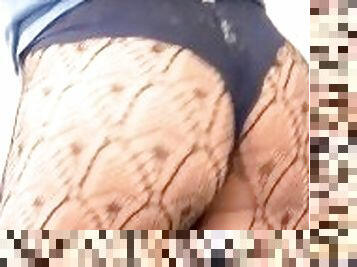 Sexy transvestite wearing panties and fishnets
