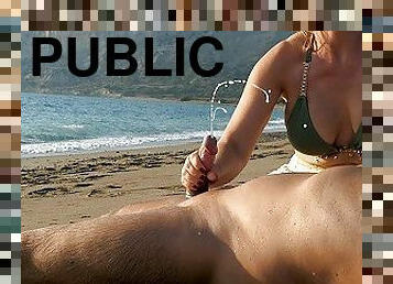 PUBLIC BEACH HANDJOB: Beauty in Bikini makes him get a huge cumshot at the beach