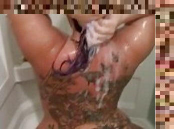 Curvy pawg on her knees in a steamy soapy shower
