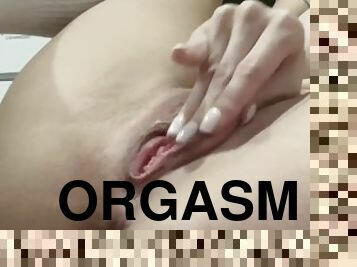 A beautiful pussy is caressed and fucked with fingers and dildo to orgasm