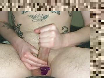 Tattooed male wanks with vibrating rabbit cock ring