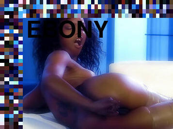 Ebony Marie Luv teases her ass with a glass dildo