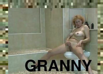 Nasty granny masturbates her old pussy in the bathroom