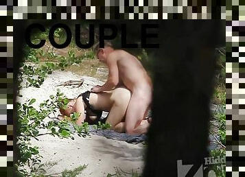 Couple filmed by hidden camera at nude beach.
