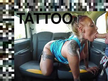 Juicy blonde with many tattoos gets holes fisted and fucked