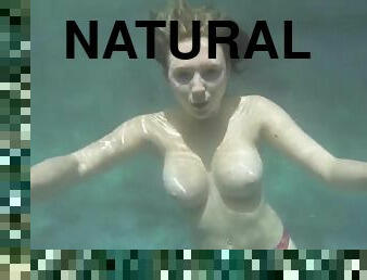 Hot young girl with big natural tits outdoors in the pool
