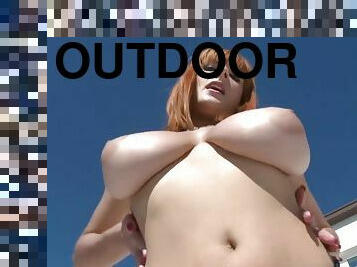 silly redhead babe - solo striptease outdoors