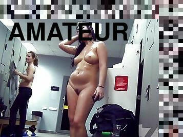 Naked brunette in the locker room after a workout.