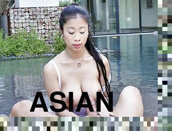 Wet big tit Asian 18-year-old babe on male stick in the pool