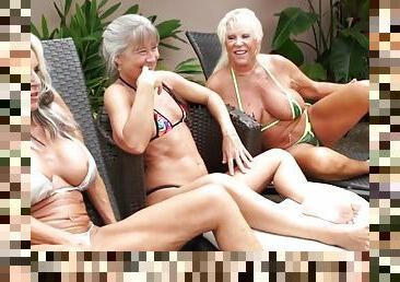 Mature grannies share BBC in outdoor interracial threesome by the pool