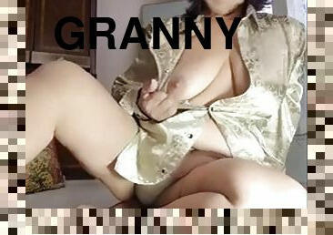 Granny enjoys two dildos at the same time