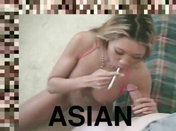 Asian sucks a dick with a cigarette in hand