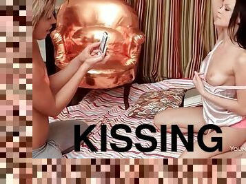 Girls film their kissing with a cell phone