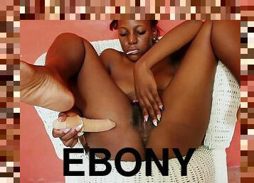 Ebony girl with a dildo in the vagina