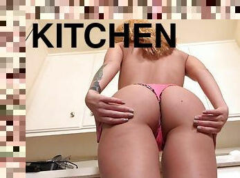 Blonde teen playing with her new dildo in the kitchen