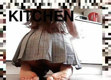 Beautiful bare feet in the kitchen