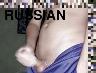 Russian guy in sweatpants jerks off and cums