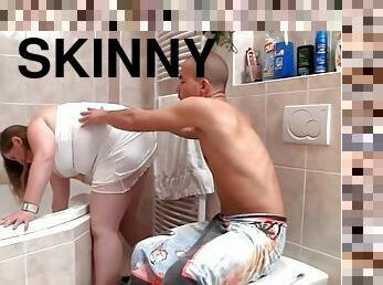 Skinny guy bangs fat girlfriend in the bathroom