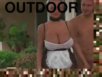 Girl in business suit sucks cock outdoors