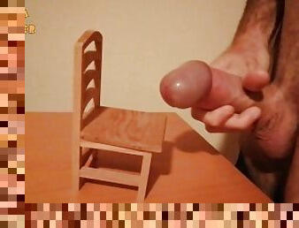 Handjob and cumshot on a small wooden chair