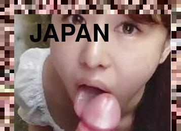 Japanese woman giving blowjob outside