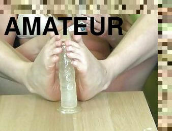 Footjob with chrystal dildo close up