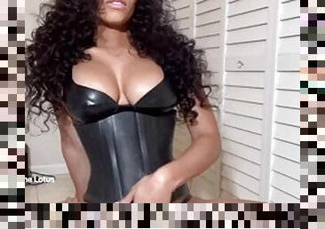 Beautiful black tranny in a corset