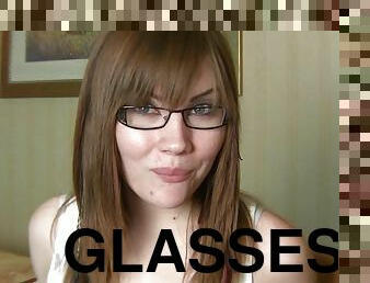 Sexy glasses on a gum chewing teen brunette