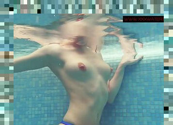 Teen swimming in a thong bikini gets naked in the pool
