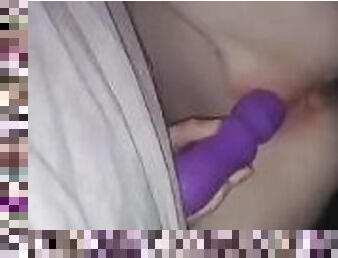 Tiny slut using massager on pussy