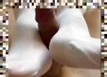 White Stockings Nylon footjob. Jerking his cock with my  feet in white stockings.