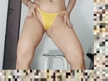 Mirella Delicia is a naughty bitch dancing in a little black dress and yellow panties punched in a big ass while doing a striptease